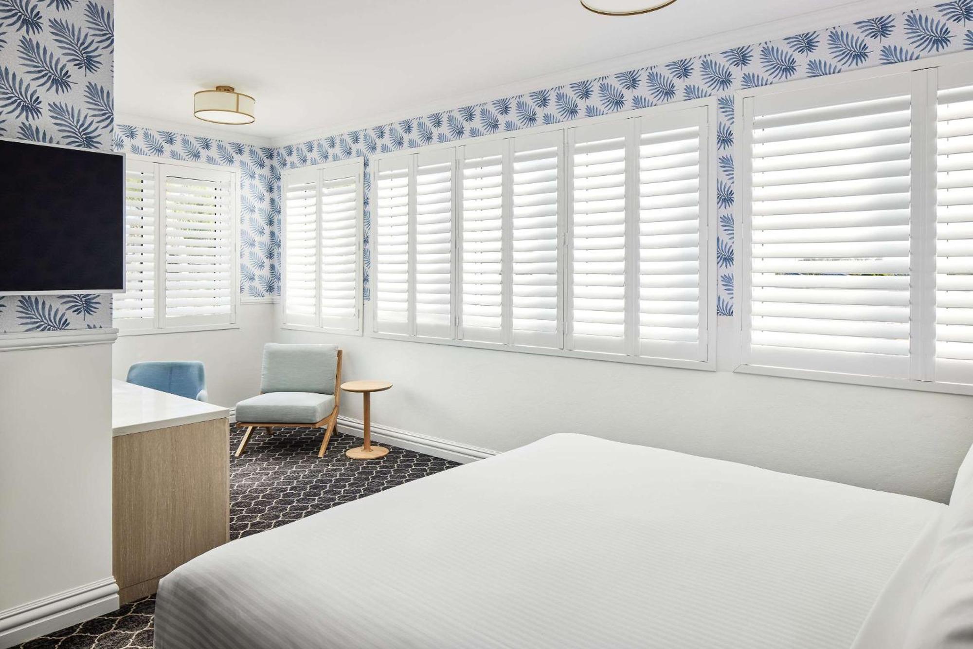 The Beachcomber Hotel & Resort, Ascend Hotel Collection Toukley Bagian luar foto A bedroom with shutters