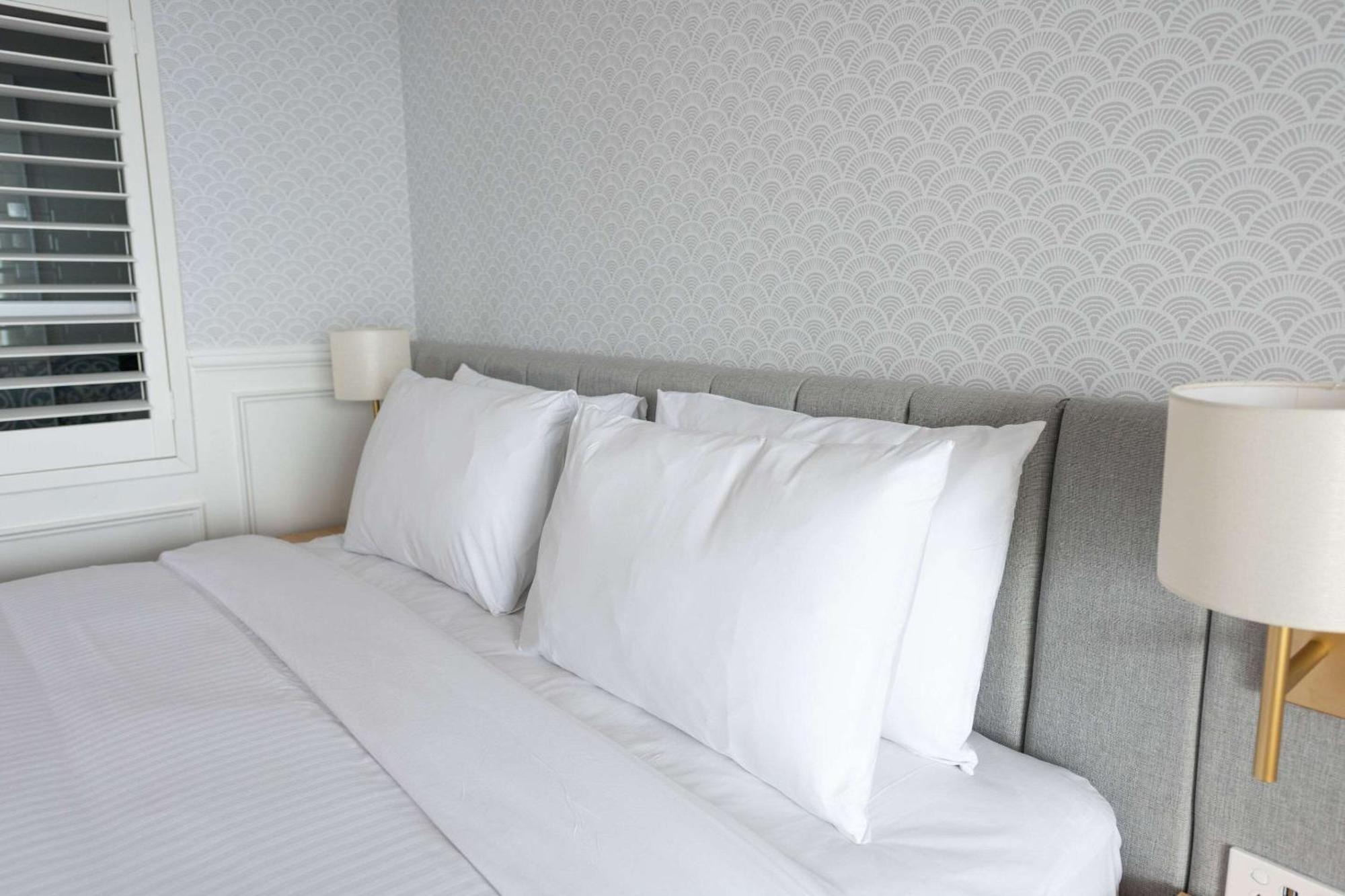 The Beachcomber Hotel & Resort, Ascend Hotel Collection Toukley Bagian luar foto Pillows on a bed